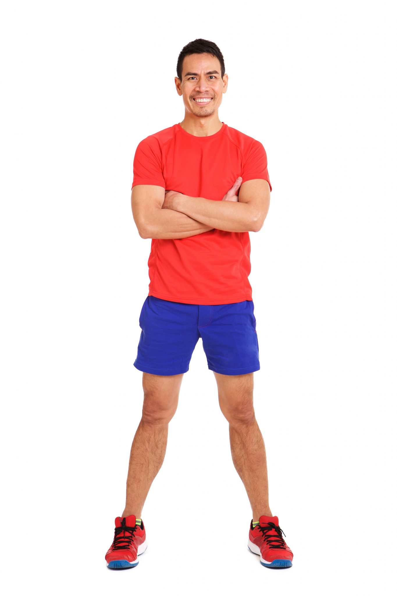 Full body portrait of healthy mature asian man in sportswear standing on white background